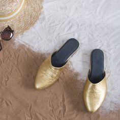 [$150 deposit towards $300 total] The Sparrow is an easy to slip-on and go almond toe mule available in every single one of my material choices! This style is open at the heel, with a supportive memory foam footbed, and a slip-resistant rubber sole. See my size range. A $150 deposit reserves your spot in my production schedule. Approximately one week before I start making your shoes I'll send you a link to choose your style, material/color, size, width and any applicable custom details along wit Gold Slip-on Mules For Spring, Casual Gold Slip-on Mules, Casual Gold Closed Toe Mules, Leather Slip-on Slippers For Galas, Chic Closed Toe Slip-ons With Branded Insole, Summer Pointed Toe Slippers With Leather Sole, Chic Slip-on Mules With Leather Footbed, Slip-on Mules With Rubber Sole And Almond Toe, Closed Toe Slides With Leather Sole