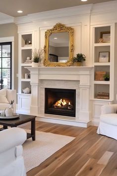 a living room filled with furniture and a fire place in the middle of a room