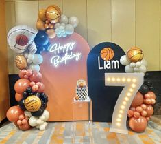 a birthday decoration with balloons and basketballs