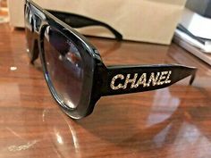 (eBay) Chanel Black sunglasses With Crystals Chanel Slides Outfit, Designer Sunglasses With Uv Protection For Party, Designer Sunglasses With Mirrored Lenses For Parties, Designer Party Sunglasses With Mirrored Lenses, Designer Polarized Sunglasses For Party, Designer Party Sunglasses With Polarized Lenses, Designer Sunglasses With Gradient Lenses, Chanel Glasses Sunglasses, Chanel Sunglasses Women