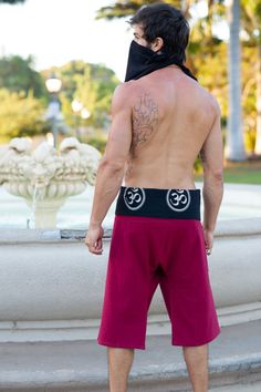 Our take on a traditional “Thai Fisherman” pant. 100% high quality hand dyed cotton with a printed band in either the ancient symbol of “flower of life” or “Ohm”. A wonderful alternative to your regular yoga shorts, or just so amazingly comfortable to wear around the house or out to casual events. These are one size fits all "natural wrap" and tie shorts. Popular with Yogi's, Message Therapists, and any other activities that require a free range of motion.Waist 28-48in Length 26in Inseam 16in Cotton Hippie Yoga Pants, Hippie Cotton Yoga Pants, Buddha Pants, Yoga Pants Men, Thai Fisherman Pants, Fisherman Pants, Mens Shorts Outfits, Harem Shorts, Festival Pants