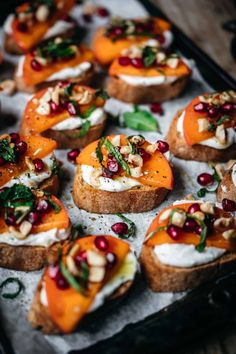 baked sweet potatoes with goat cheese and pomegranates on a baking sheet