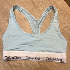 Size Small But Fits More Like An Xs. Never Worn. Unlined Cotton Bralette/ Sports Bra With Signature Calvin Klein Band. Calvin Klein Seamless Spring Bra, Spring Stretch Calvin Klein Bra, Blue Racerback Sports Bra With Adjustable Straps, Blue Sports Bra With Adjustable Straps For Summer, Fitted Calvin Klein Bra For Summer, Calvin Klein Fitted Bra For Summer, Fitted Calvin Klein Summer Bra, Casual Blue Fitted Bra, Calvin Klein Bra