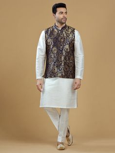 A gold zari brocade vest to pair with any kurta with statement button closures at the front. Occasion: Style this vest with pajama pants and a kurta for a welcome dinner or sangeet night, or style it with a any dress shirt and trousers for a sleek Indian wedding reception look! WASH CARE INSTRUCTIONS - Please Dry clean only. Slight color variation is possible due to digital photography. **Kurta & Pajama not included Sleeveless Bandhgala For Eid, Sleeveless Nehru Jacket For Diwali, Brocade Nehru Jacket For Diwali Designer Wear, Diwali Brocade Nehru Jacket For Designer Wear, Diwali Designer Brocade Nehru Jacket, Gold Nehru Jacket For Festivals, Straight Kurta Style, Traditional Sleeveless Nehru Jacket For Festive Occasions, Traditional Sleeveless Vest For Eid, Traditional Sleeveless Kurta For Festivities