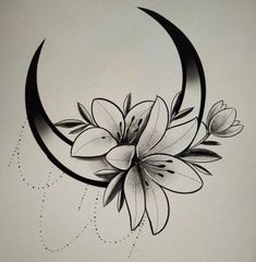 a black and white drawing of a crescent with flowers on the bottom half of it