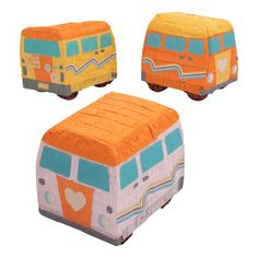 an orange, yellow and blue bus shaped stool with hearts on the front is shown in three different angles