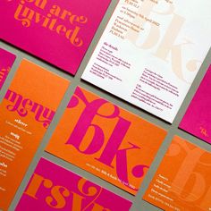 some pink and orange business cards on top of each other with the letter blk