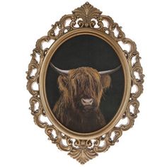 a painting of a brown cow with long horns in a gold frame on a white background