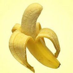 a peeled banana sitting on top of a table