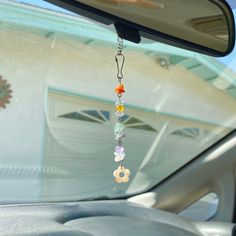 a car dashboard with a chain hanging from it's side window