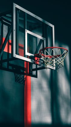 a basketball going through the rim of a hoop