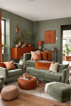 a living room filled with green couches and orange pillows on top of each other