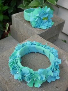 two cement blocks with blue flowers on them