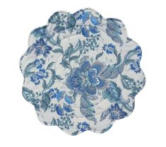 four blue and white plates with floral designs on the sides, one is made out of cloth