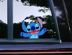 a cartoon character is seen in the window of a car