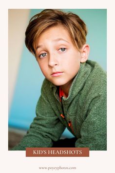 a young boy is posing for a photo with his head turned to the side and eyes closed