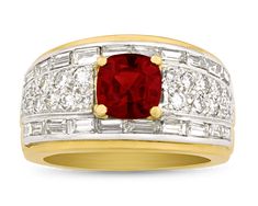 A cushion-cut ruby displays a deep crimson hue in this glittering ring from famed American jeweler David Webb. Surrounded by round and baguette diamonds totaling 1.80 carats, the jewel's warmth is highlighted by its 18K yellow gold and platinum settings. Once described as "today's Fabergé" by the Duchess of Windsor, jet-setting Madison Avenue-based designer David Webb was known for his innovative designs and celebrity clientele, which included the likes of the Duchess, Jackie Kennedy and Elizabe Luxury Red Diamond Ring With Single Cut Diamonds, Fine Jewelry Red Diamond Ring With Pave Setting, Red Diamond Ring With Brilliant Cushion Cut, Red Cushion Cut Brilliant Diamond Ring, Red Diamond Ring With Pave Setting, Red Ruby Ring With Diamond And Pave Setting, Red Cushion Cut Diamond Ring With Brilliant Cut, Luxury Red Cushion Cut Ruby Ring, Formal Red Diamond Ring With Pave Setting