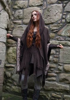 Dark and Earthy Druid Cape This cape measures 29.50 inches/ 74.95 cm in the length and 41 inches/ 104.15 cm in width. The belt is 79.50 inches/ 201.95 cm. This brown wool cape comes with a  half depth draping Druid hood which contributes to a mystic and otherworldly look. It comes with a belt and can be wrapped in a variety of ways. The cape is decorated with celtic knotwork which is embroidered on woven cotton with rustic tapered edges. >> Brooch displayed during the video is not included but i Druid Inspiration, Druid Cloak, Medieval Outfits, Viking Cloak, Brooch Display, Wool Cloak, Celtic Fashion, Winter Cloak, Visual Clothing