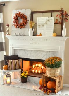 a living room with a fire place filled with pumpkins and other fall decorations on the mantle