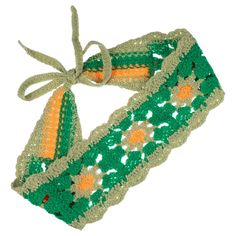 two green and orange crocheted scarves with bows on the top one has an orange flower