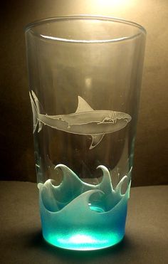 a glass with an image of a dolphin on it