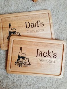 two personalized wooden serving trays on the floor