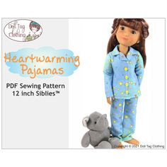 the doll is wearing pajamas and holding a stuffed animal