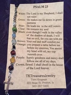 a necklace with a cross on it that says, ` person is my shepherd i shall not want to make me down in green '