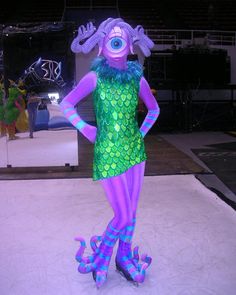 a purple and green costume is on display