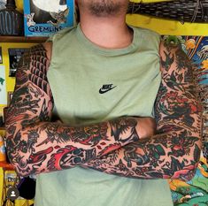 a man with tattoos on his arm and arms