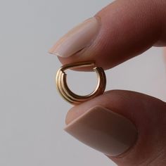 This 14k gold filled triple stacked septum ring is the perfect statement ring for everyday wear. It is lightweight and the straight pin makes for a very comfortable fit. Much flashier than our regular simple septum rings, and but still minimal in style and function. This ring is only available in 16 gauge. When putting this ring in, we recommend bending the pin up at an angle, and use your thumb to push the pin back down to create the horseshoe desired shape. This ring is not hinged, you must be Dainty Everyday Huggie Rings, Everyday Hoop Rings In Recycled Gold, 14k Gold Huggie Rings For Everyday, Everyday 14k Gold Huggie Rings, Gold Septum Ring For Everyday Wear, Dainty Tarnish-resistant Huggie Rings, Everyday Gold Septum Ring, Dainty 14k Gold Huggie Rings, Everyday Gold Huggie Rings