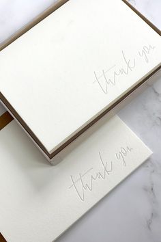 two thank you cards with writing on them