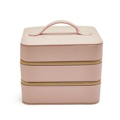 Made of vegan leather with polyester lining. Features 2 compartments and 4 pockets. Metal zipper. Imported. Spot clean. Beauty Storage, Spot Cleaner, Leather Travel, Metal Zipper, Cosmetic Case, Pale Pink, Pottery Barn, Vegan Leather, Zipper