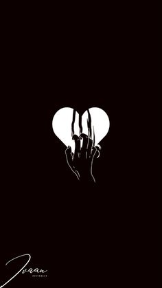 a black and white poster with two hands holding a heart