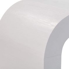 a close up of a white paper roll on a white background with no image to describe