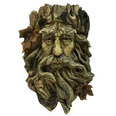 a statue of a man with leaves on his head