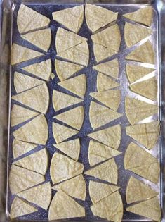 tortilla shells on a baking sheet ready to go into the oven for cooking