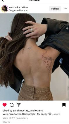 a woman with a tattoo on her back