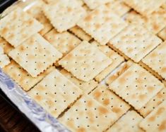 crackers on a baking sheet ready to be baked in the oven for dinner time