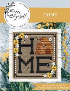 a cross stitch pattern with the words home and a bear on it, surrounded by yellow flowers