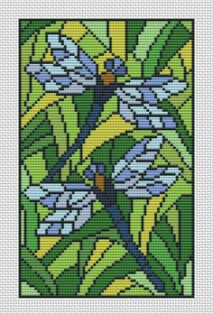 a cross stitch pattern with blue and yellow dragonflys on green leaves in the background