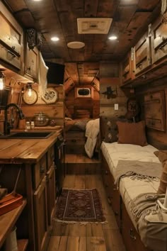 the interior of an rv with wooden walls and flooring, wood paneled ceiling