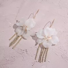 Penelope Flower and Rhinestone Tassel Earrings are flirty feminine flower earrings featuring statement-making rhinestone strands that sparkle and shine. Perfect for when you want to add that final touch that will catch the spotlight, these glamorous earrings are perfect for when you want to stand out in a crowd! About 5 inches long Special occasion item = FINAL SALE Penelope Flower, Rhinestone Tassel Earrings, Face Gems, Ear Jacket Earring, Earring Jackets, Sparkle And Shine, Ring Sale, Clay Flowers, Final Touch