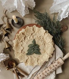 a pie sitting on top of a table next to christmas decorations