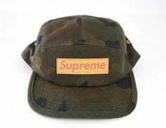 The highly coveted and sought after Louis Vuitton X Supreme Very Limited Edition Green Camouflage 5 panel Cap.Front Supreme leather plaque.Adjustable rear leather strap with buckle. Comes with LV gift box.NEW or NEVER WORN Adjustable Leather Hat For Streetwear, Military Style Baseball Cap With Flat Bill For Streetwear, Military Style Flat Bill Hat For Streetwear, Military Style Flat Brim Hat For Streetwear, Military Style 5-panel Streetwear Hat, Military Style Baseball Cap With Flat Brim, Military Style Snapback Hat With Flat Brim, Military Style Flat Cap For Streetwear, Military Style Snapback Hat For Streetwear