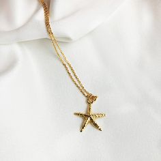 "This is wonderful GOLD STARFISH NECKLACE, The perfect Personalized Beach jewelry to wear everyday , you can add a simple touch to your look , its perfect for summer, beautifull detailing on both front and back. Great gift for all Sea Life lovers. ♡ DETAILS Necklace length : please choose Pendant : 1.5 cm- 0.59\" Material: 24k gold plated sterling silver 925 Please note that the chain may vary slightly from the ones shown above. ♡ PERSONALISATION How about adding one of my Swarovski birthstone p Gold Starfish Clavicle Chain Necklace, Gold Charm Necklace With Starfish Charm, Gold Starfish Charm Necklace, Gold Starfish Necklace With Lobster Clasp, Yellow Gold Star Necklaces With Starfish Charm, Yellow Gold Starfish Necklace As Gift, Starfish Charm Necklace Perfect For Gifts, Starfish Charm Necklaces For Gifts, Starfish Charm Necklace As Gift