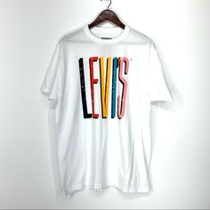 Levi’s Retro Lightweight Tee. Minor Imperfection Above The Letter S. 100% Cotton. Levi's White Short Sleeve Shirt, Levi's White Cotton Top, Levi's White Relaxed Fit Shirt, White Cotton Levi's Top, Casual White Levi's Top, White Levi's T-shirt For Summer, Levi's White Relaxed Fit Top, Levi's White Graphic Print T-shirt, Levi's White Graphic Tee