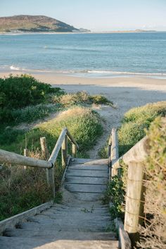 stairs lead down to the beach and ocean