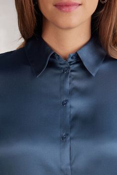 Long sleeve shirt in light stretch silk with collar and buttons up the middle. Back yoke with pleat for a draped, loose fit. Buttoned cuffs and rounded hem. Elegant Business Casual Blouse With Rolled Sleeves, Elegant Blue Tops With Button Cuffs, Elegant Blue Top With Button Cuffs, Elegant Blouse With Rolled Sleeves For Business Casual, Elegant Shirt With Collared Neckline And Placket, Chic Blue Blouse With Spread Collar, Elegant Collared Shirt For Daywear, Classic Blouse With Rolled Sleeves, Elegant Blue Top With Collared Neckline