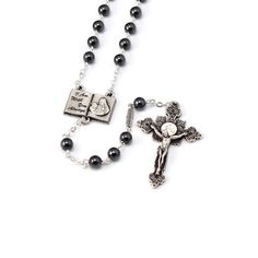 - 6 mm semi-precious stone beads - Hematite - Silver plated finish with Ghirelli brand plate - Centerpiece “Book of Life”, with passage of the Gospel, antique silver plated finish - Eucharistic Ostensory crucifix with hand-enameled Host inspired by the Real Presence of Jesus in the Most Sacred Eucharist and by the Gospel passage "I am with you always” Matthew 28:20, antique silver plated finish Silver Hematite Necklace With 8mm Beads, Vintage Silver Rosary With Round Beads, Silver Rosary With Natural Stones For Gift, Silver Rosary With Natural Stones As A Gift, Silver Rosary With Natural Stones, Silver Rosary With Natural Stones And Round Beads, Spiritual Silver Hematite Necklace, Silver Hematite Jewelry With 8mm Beads, Plate Centerpiece